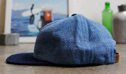 editorial image of a row of TS x Hypeadelic indigo caps