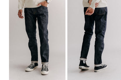 Split shot showing our guy from the front and back, in slim fit selvedge jeans and a plain white tee.