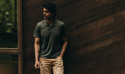 fit model posing in The Merino Polo in Heather Army