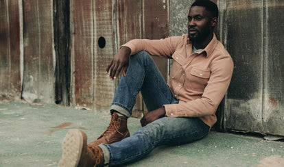 fit model sitting wearing The Slim Jean in Sawyer Wash Organic Selvage