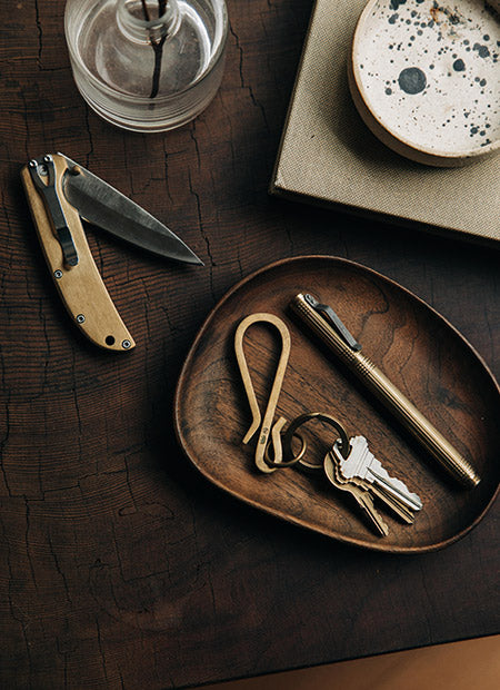 Brass accessories, like The Drop Point Knife, The Keyhook and the Pen in Brass, by Taylor Stitch