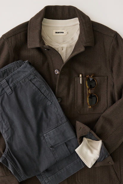 editorial flatlay of The Ojai Jacket in Army Herringbone Wool