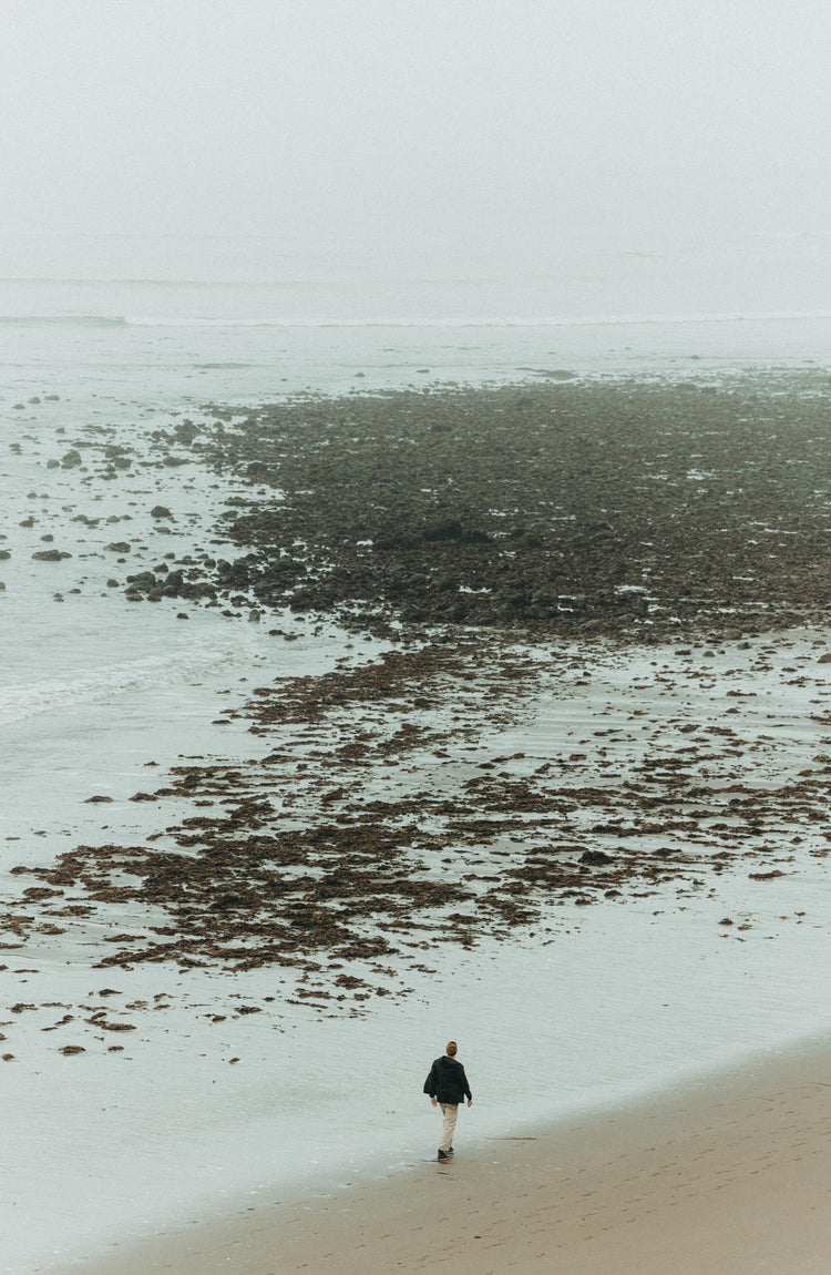 Man walking along the coast in Marin