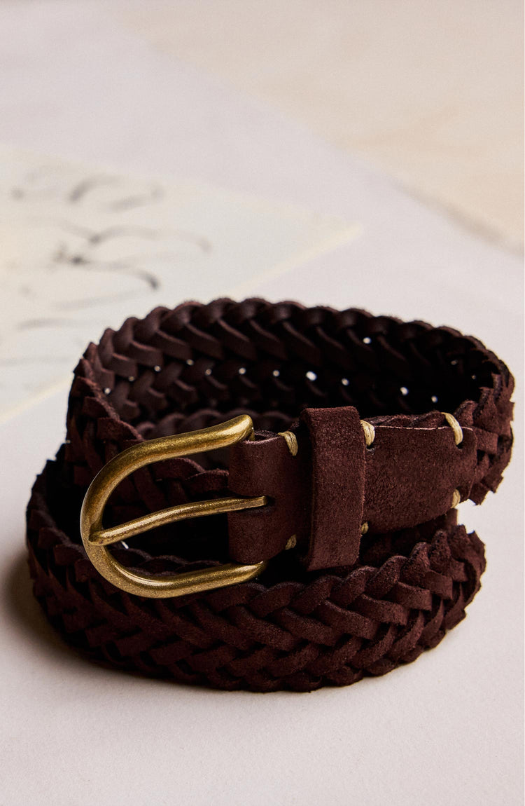 editorial image of The Braided Belt in Chocolate Suede rolled up