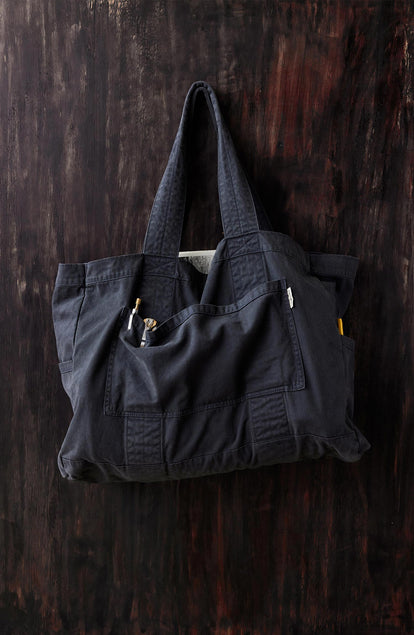 editorial image of The Foundation Tote in Organic Navy hanging