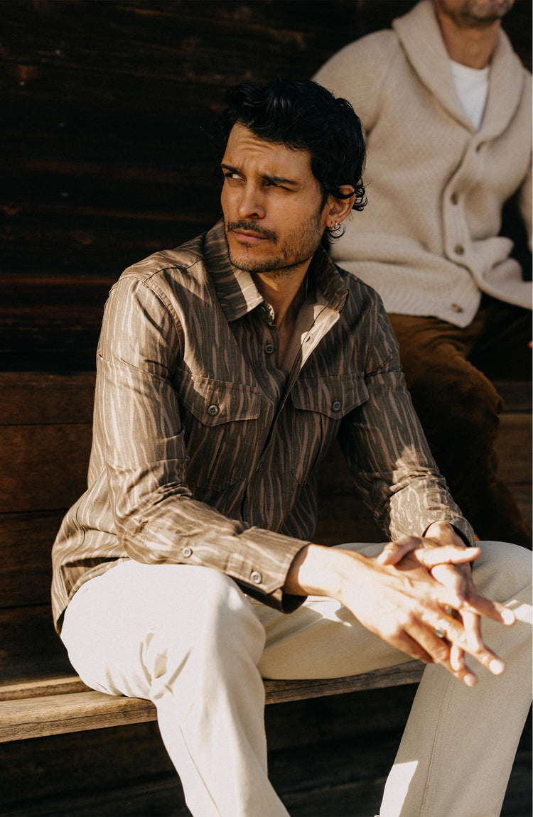 fit model sitting wearing The Saddler Shirt in Bark Print Broken Twill