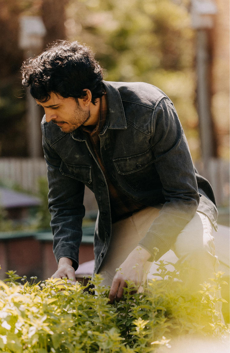 fit model gardening wearing The Shop Shirt in Coal Chipped Canvas