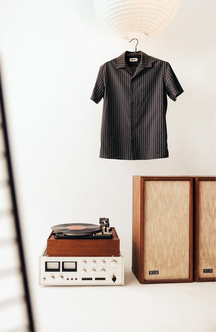 editorial image of The Short Sleeve Davis Shirt in Kelp Stripe on a hanger