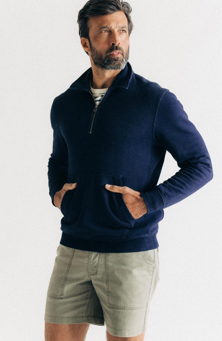 fit model with his hands in his pocket wearing The Apres Quarter Zip in Rinsed Indigo Terry