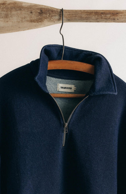 editorial image of The Apres Quarter Zip in Rinsed Indigo Terry hanging