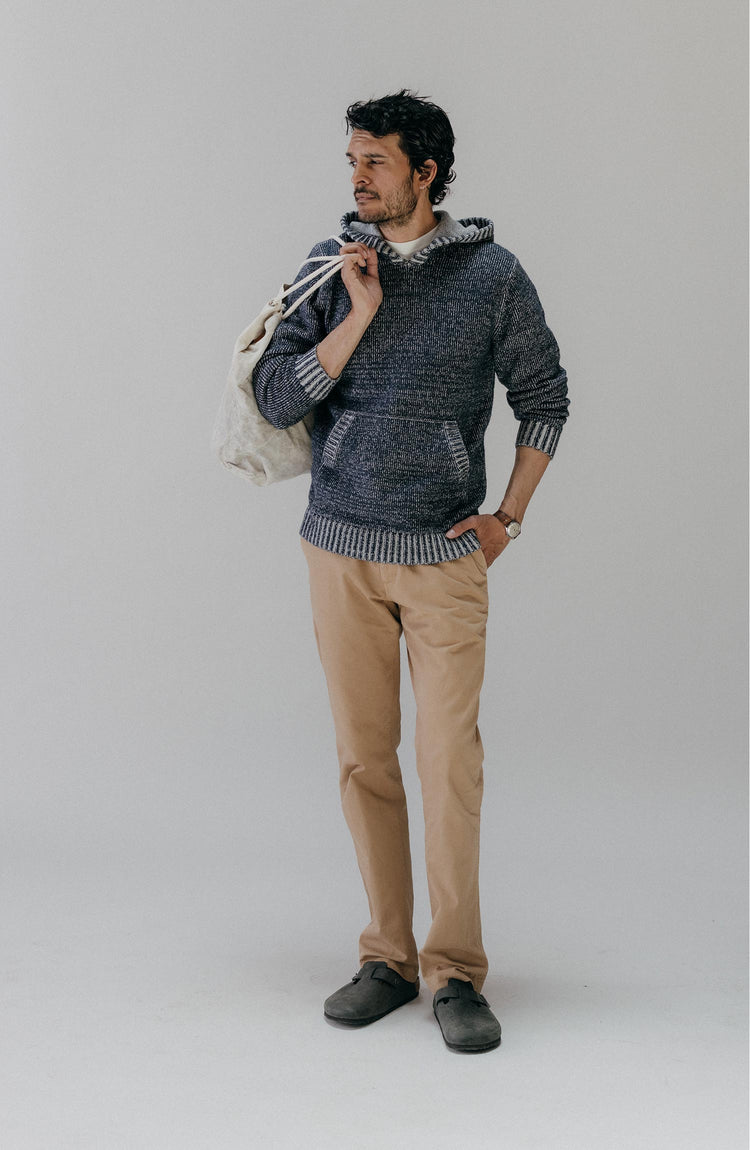 fit model posing wearing The Headland Pullover Sweater in Marled Navy