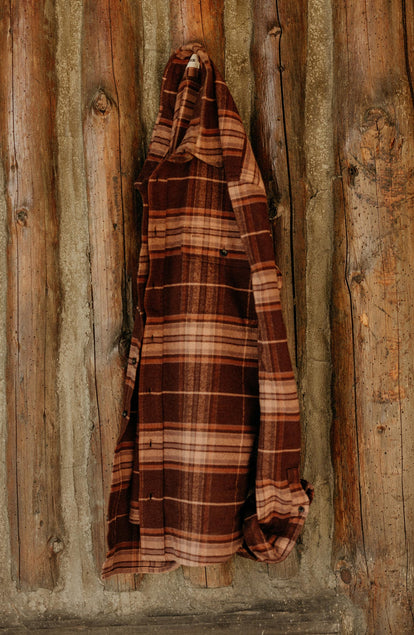 editorial image of The Ledge Shirt in Chestnut Plaid hanging