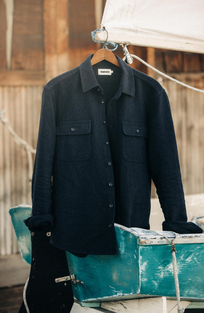 editorial image of The Ledge Shirt in Dark Navy Linen Tweed on a hanger