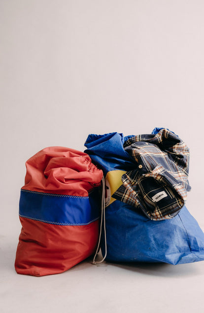 editorial image of The Ledge Shirt in River Plaid on a bag