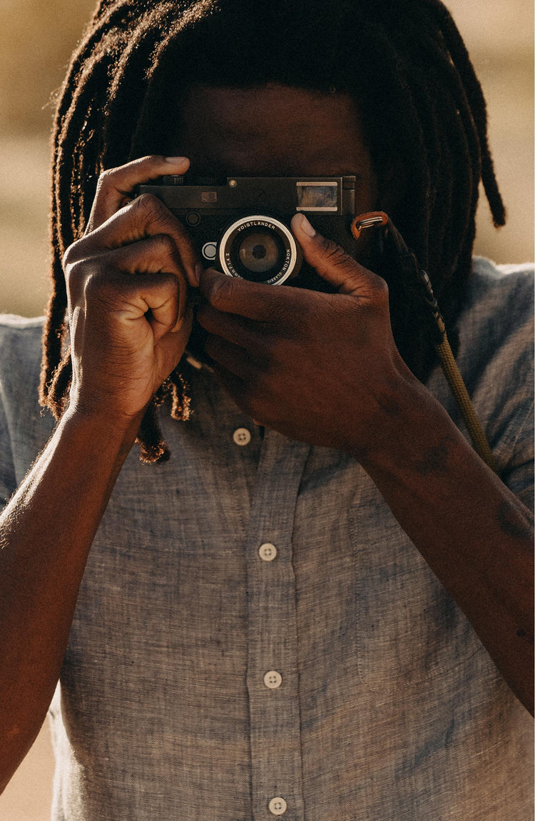 fit model taking a photo wearing The Short Sleeve California in Faded Navy Hemp