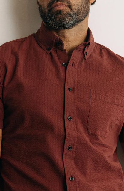 fit model showing off the buttons on The Short Sleeve Jack in Dried Cherry Seersucker