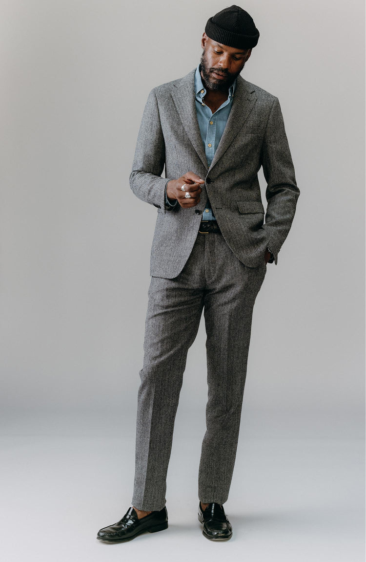 fit model posing in The Stevens Trouser in Slate Herringbone Wool