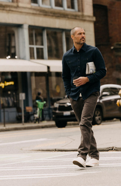 editorial image of The Utility Shirt in Natural Sashiko on a book