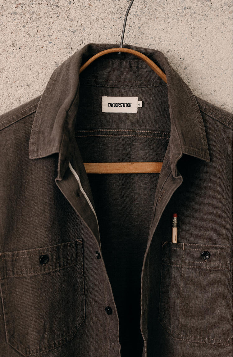 editorial image of The Utility Shirt in Soil Selvedge Denim hanging