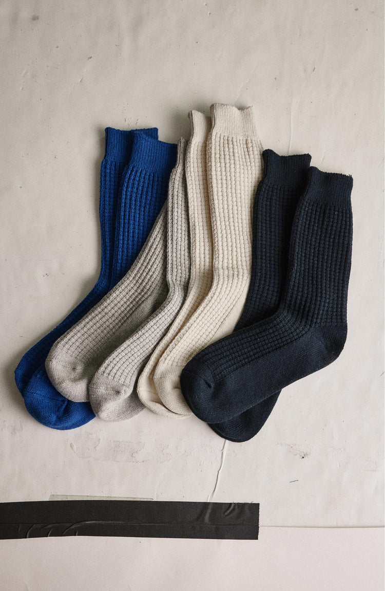 editorial image of The Waffle Sock in Natural next to various socks