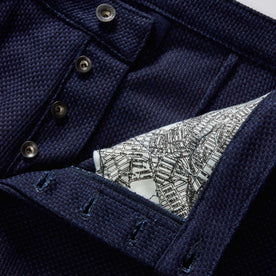 material shot of the button fly on The Camp Pant in Rigid Indigo Sashiko, Bottoms by Taylor Stitch