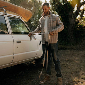 fit model holding a rope wearing The Cutter Overshirt in Grey Plaid, Wovens by Taylor Stitch