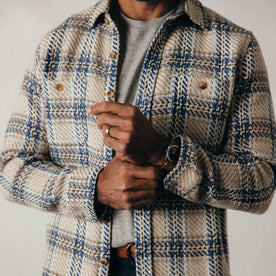 fit model adjusting the cuffs on The Cutter Overshirt in Sandbar Plaid, Wovens by Taylor Stitch