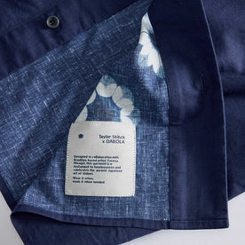 material shot of the tag on The Davis Shirt in Dark Navy Geo, Wovens by Taylor Stitch