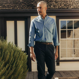 fit model walking wearing The Jack in Washed Indigo Oxford, Wovens by Taylor Stitch