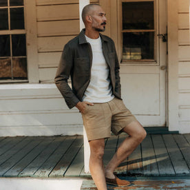 fit model on the stairs wearing The Station Jacket in Fatigue Olive Broken Twill, Outerwear by Taylor Stitch