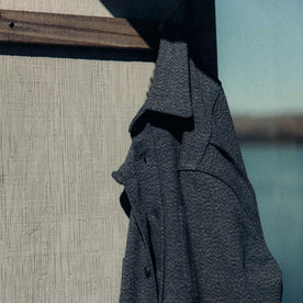 editorial image of The Utility Shirt in Indigo Ash Wool Canvas hanging, Wovens by Taylor Stitch