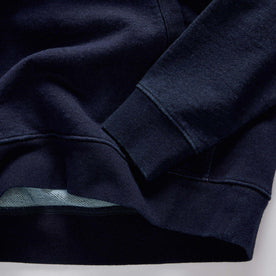 material shot of the hem on The Apres Quarter Zip in Rinsed Indigo Terry, Knits by Taylor Stitch