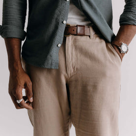 fit model with his hand in his pocket wearing The Carmel Pant in Heather Khaki Cotton Linen, Bottoms by Taylor Stitch