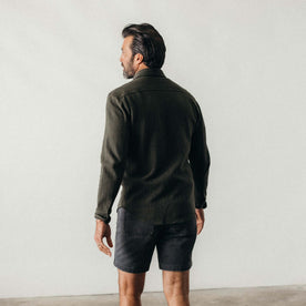 fit model showing off the back of The Coastline Knit Shirt in Heather Army, Knits by Taylor Stitch