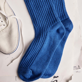 editorial flatlay of The Waffle Sock in Cobalt next to a shoe, Accessories by Taylor Stitch