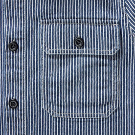 material shot of the pocket on The Shop Shirt in Rinsed Indigo Selvedge, Wovens by Taylor Stitch