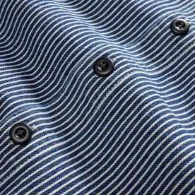 material shot of the buttons on The Shop Shirt in Rinsed Indigo Selvedge, Wovens by Taylor Stitch