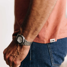 fit model showing off the bottom hem on The Cotton Hemp Tee in Fired Clay, Knits by Taylor Stitch