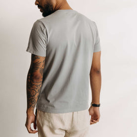 fit model showing off the back of The Organic Cotton Tee in Overcast