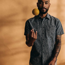 fit model throwing a ball wearing The Short Sleeve California in Blue Chambray Botanical