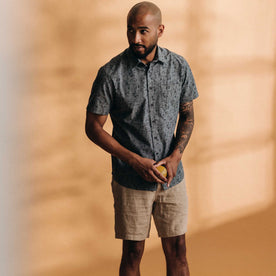 fit model standing wearing The Short Sleeve California in Blue Chambray Botanical