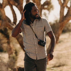 fit model walking wearing The Short Sleeve California in Faded Navy Hemp, Wovens by Taylor Stitch