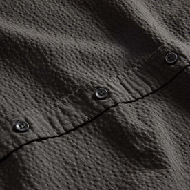 material shot of the buttons on The Short Sleeve Jack in Faded Black Seersucker, Wovens by Taylor Stitch