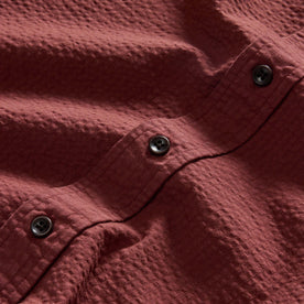 material shot of the buttons on The Short Sleeve Jack in Dried Cherry Seersucker, Wovens by Taylor Stitch