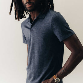 fit model posing in The Merino Polo in Heather Navy, Knits by Taylor Stitch