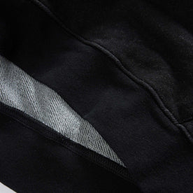 material shot of the hem on The Apres Hoodie in Black Indigo Terry, Knits by Taylor Stitch