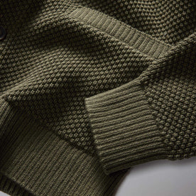 material shot of the pocket and cuff on The Crawford Sweater in Fatigue Olive, Knits by Taylor Stitch