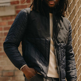 fit model with his hand in his pocket wearing The Ember Jacket in Dark Navy Quilted Nylon, Outerwear by Taylor Stitch