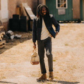 fit model walking wearing The Ember Jacket in Dark Navy Quilted Nylon, Outerwear by Taylor Stitch