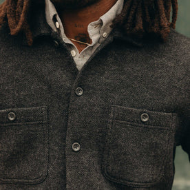 fit model showing off pockets on The Evans Overshirt in Charcoal Birdseye Wool, Wovens by Taylor Stitch